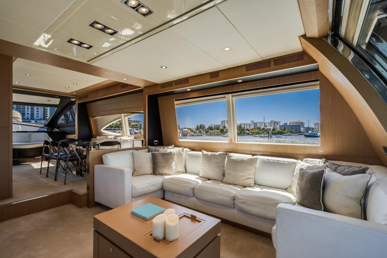 a living room with a large window aboard NAMEDROPPER Yacht for Sale