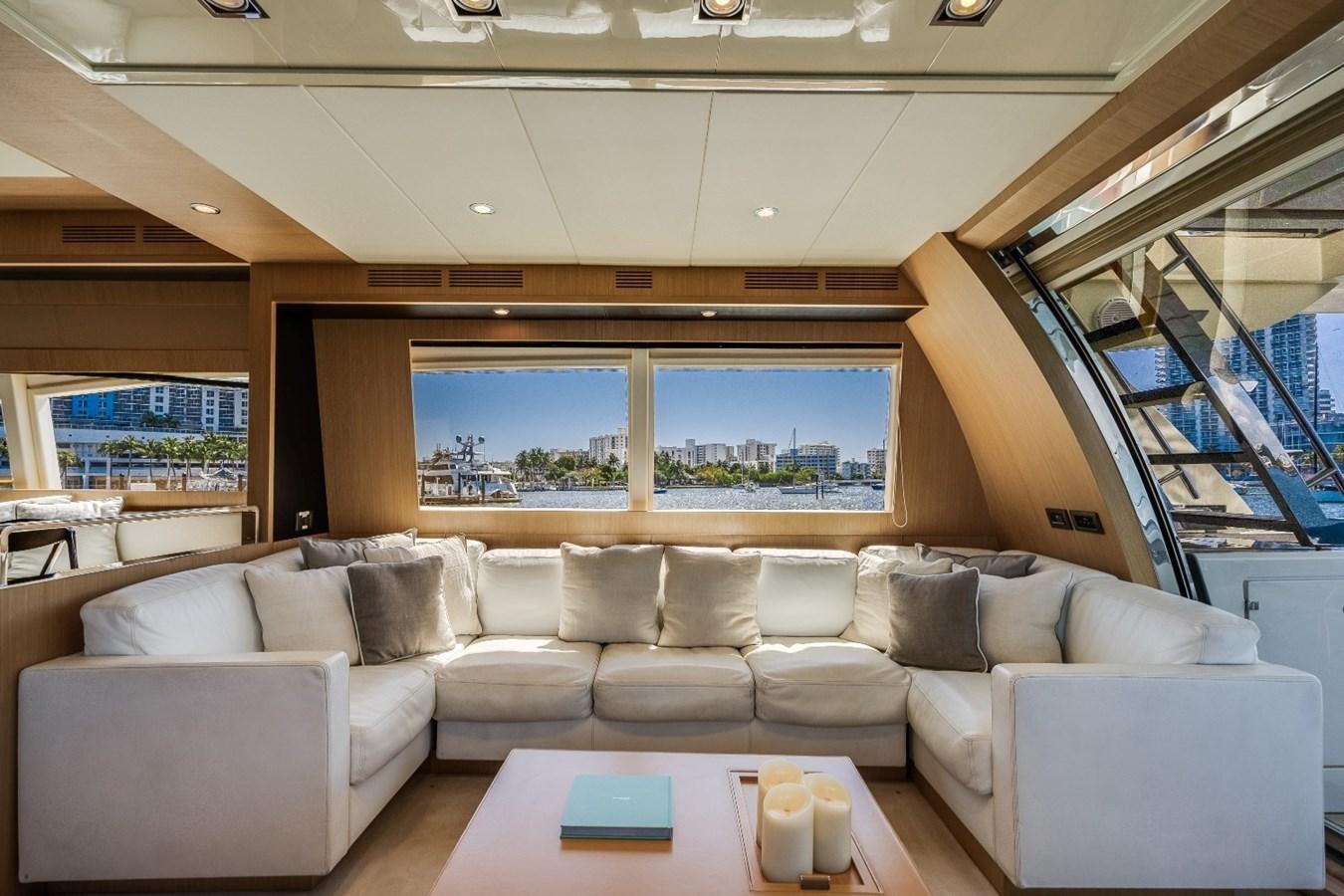 a living room with a large window aboard NAMEDROPPER Yacht for Sale