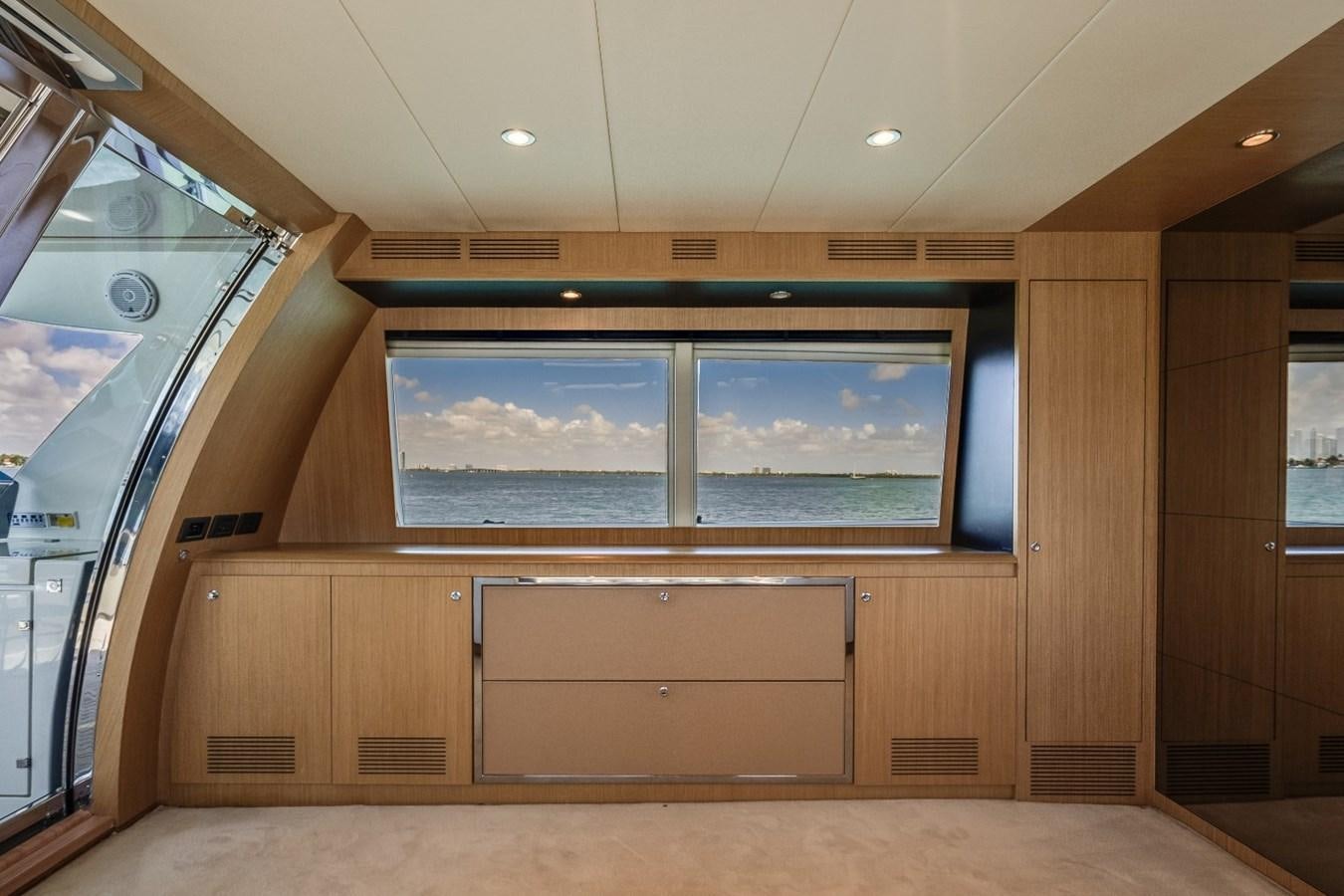 a room with a large window aboard NAMEDROPPER Yacht for Sale