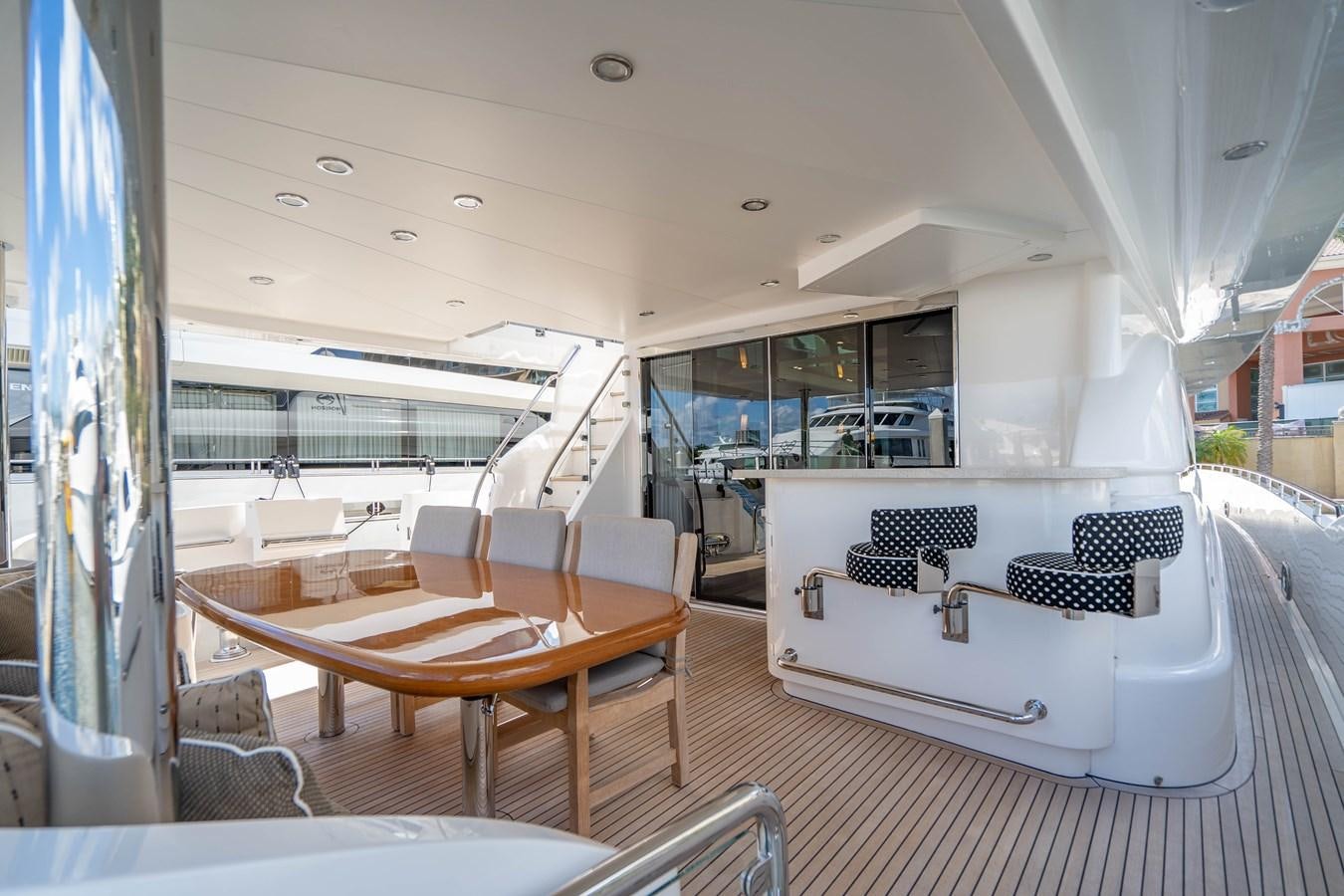 a room with a table and chairs aboard SPREZZATURA Yacht for Sale