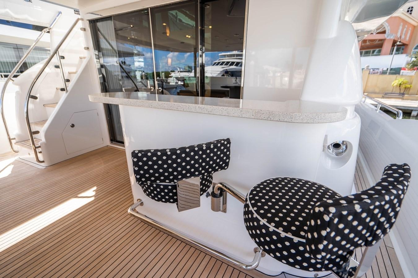 a white bathtub with a chair aboard SPREZZATURA Yacht for Sale