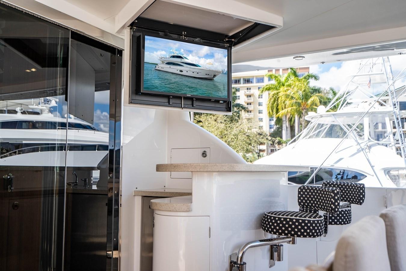 a room with a television and chairs aboard SPREZZATURA Yacht for Sale