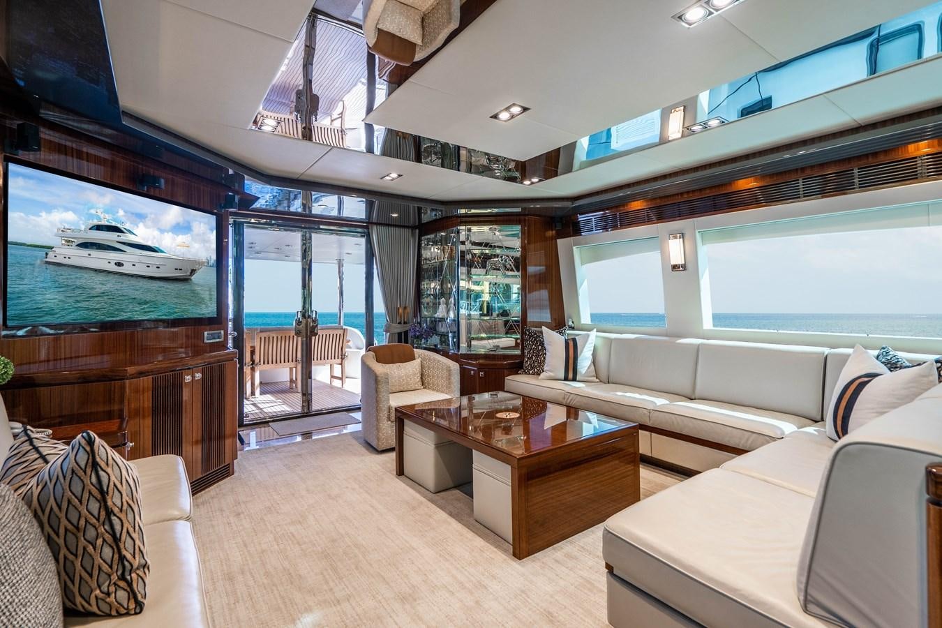 a living room with a large window aboard SPREZZATURA Yacht for Sale