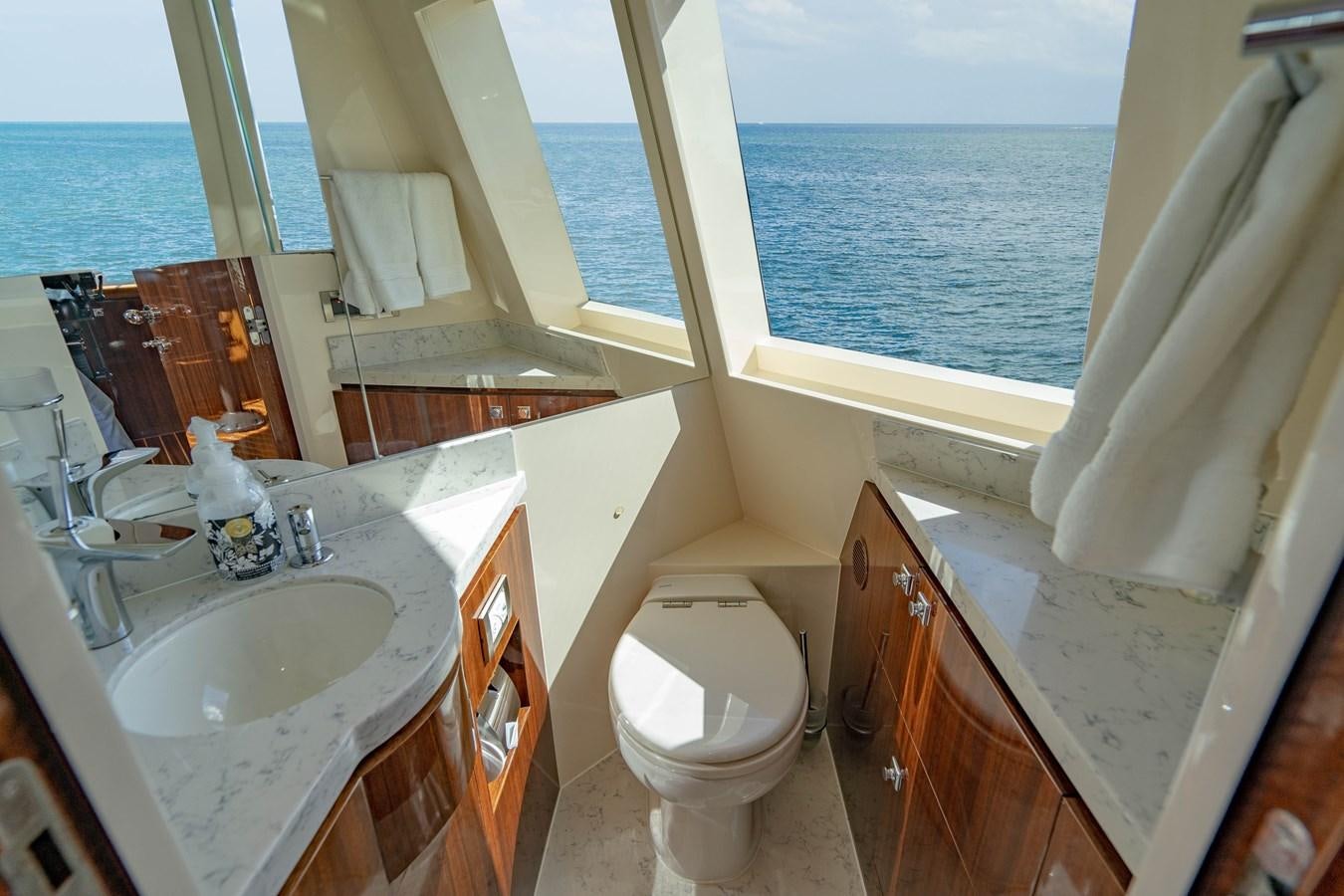 a bathroom with a sink toilet and bathtub aboard SPREZZATURA Yacht for Sale