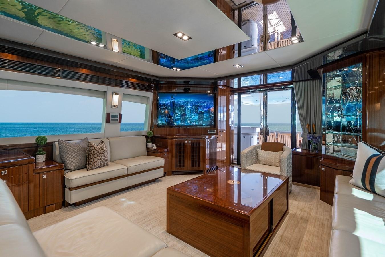 a living room with a large window aboard SPREZZATURA Yacht for Sale