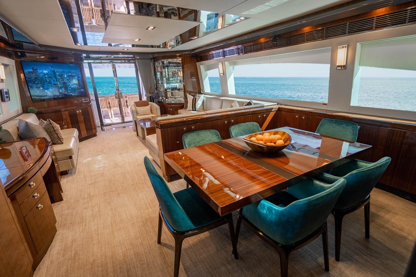 a dining room with a table and chairs aboard SPREZZATURA Yacht for Sale