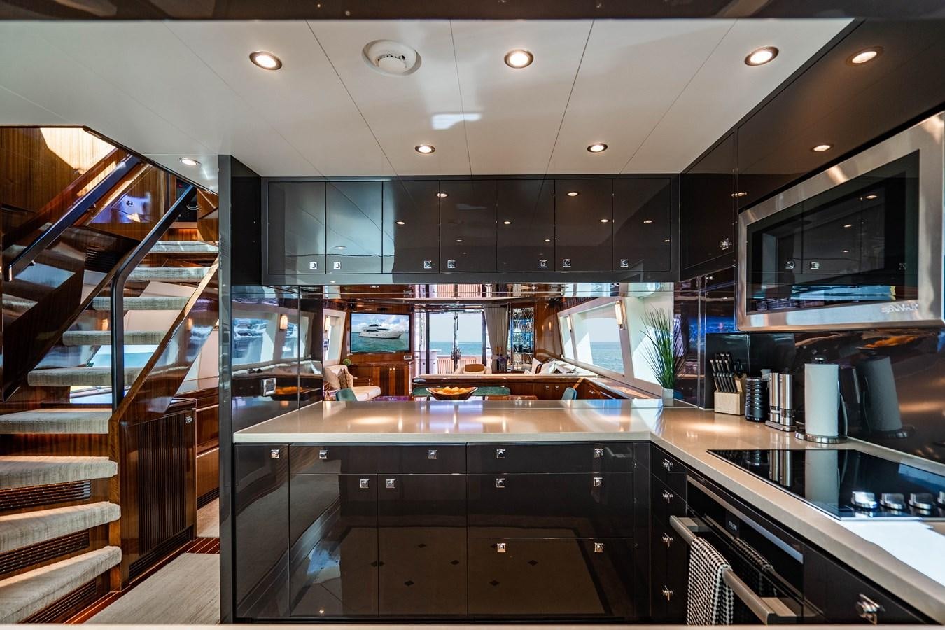 a kitchen with a glass wall aboard SPREZZATURA Yacht for Sale