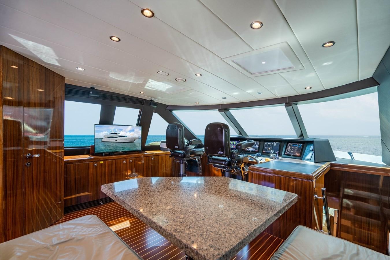 a large room with a table and chairs aboard SPREZZATURA Yacht for Sale