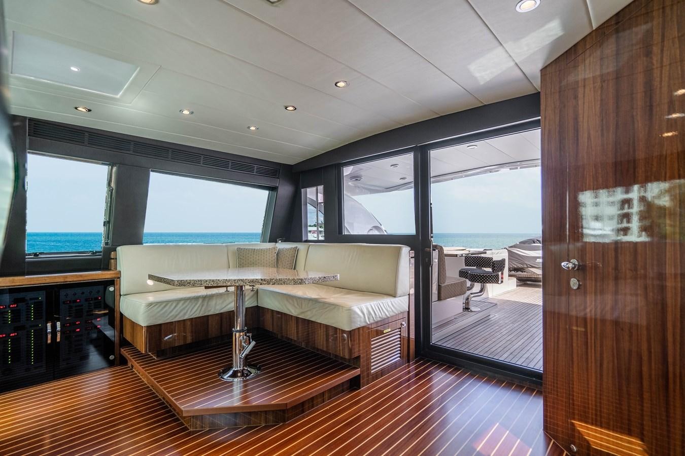a room with a couch and a table aboard SPREZZATURA Yacht for Sale