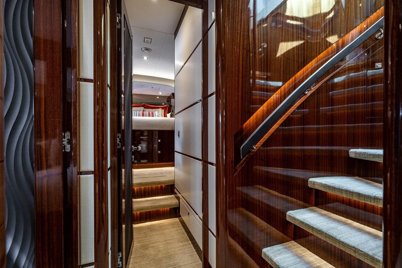a hallway with a bench and a chair aboard SPREZZATURA Yacht for Sale