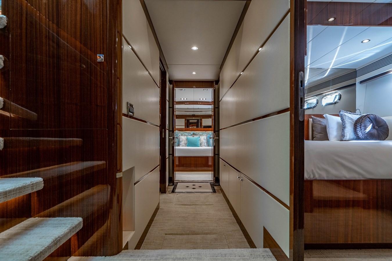 a room with a bed and a mirror aboard SPREZZATURA Yacht for Sale