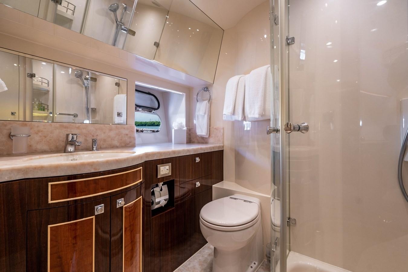 a bathroom with a glass shower aboard SPREZZATURA Yacht for Sale
