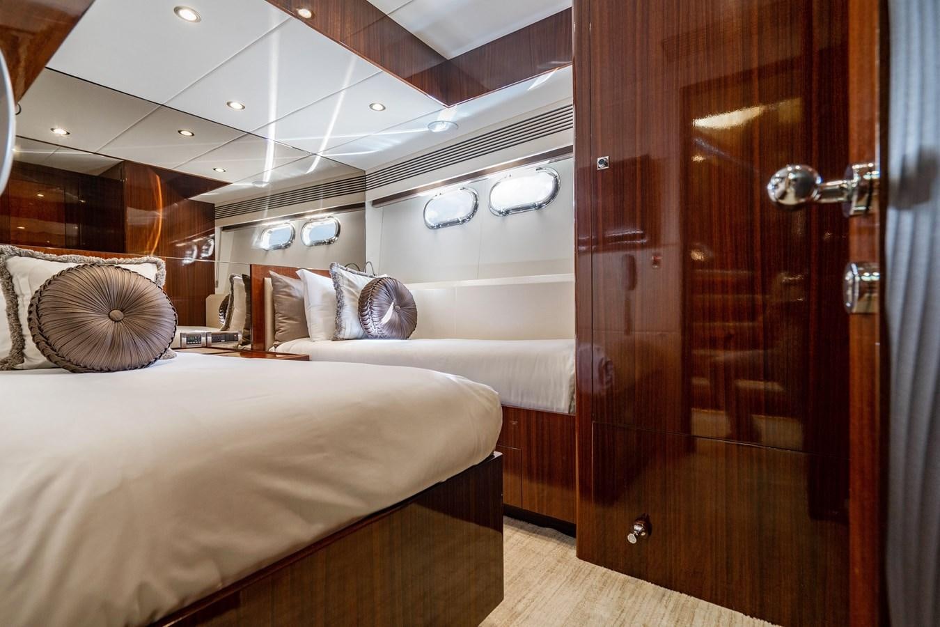 a room with a bed and a door aboard SPREZZATURA Yacht for Sale