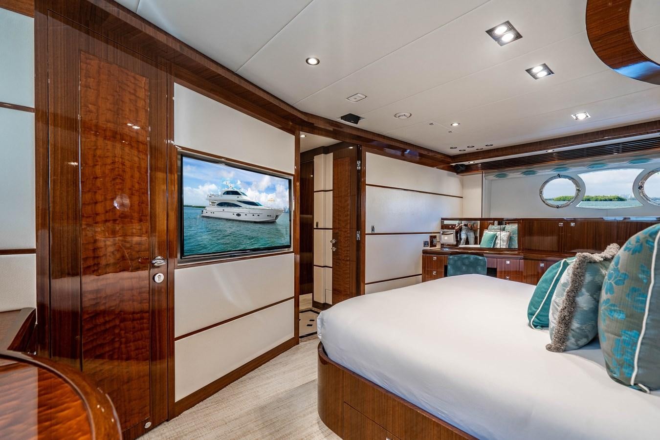 a room with a bed and a sliding glass door aboard SPREZZATURA Yacht for Sale