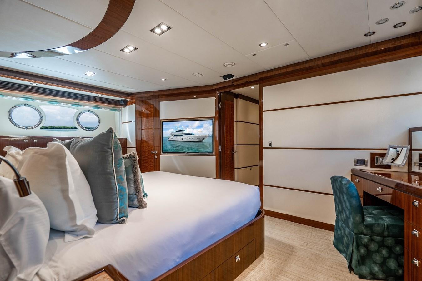 a bedroom with a bed and a television aboard SPREZZATURA Yacht for Sale