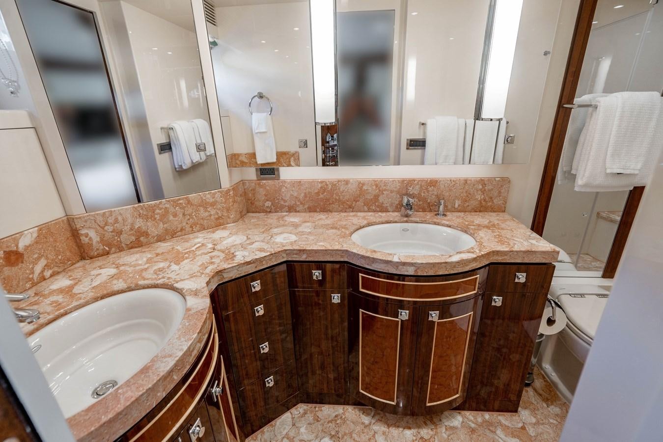 a bathroom with a countertop sink and a large mirror aboard SPREZZATURA Yacht for Sale
