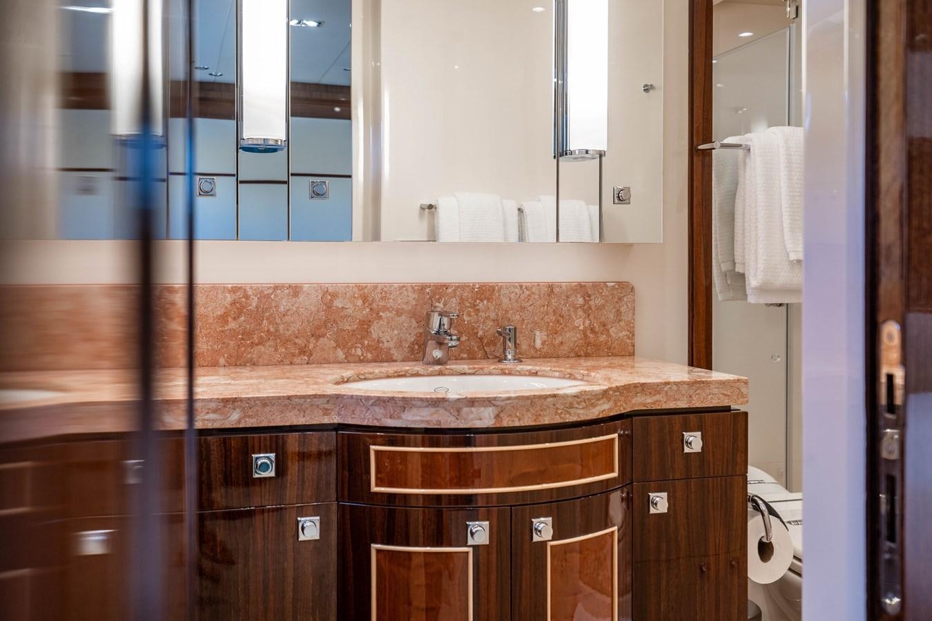 a bathroom with a countertop sink and mirror aboard SPREZZATURA Yacht for Sale