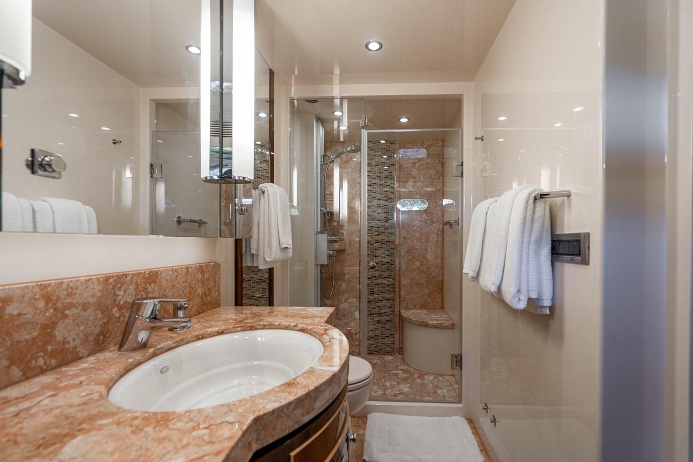 a bathroom with a sink and a shower unit aboard SPREZZATURA Yacht for Sale