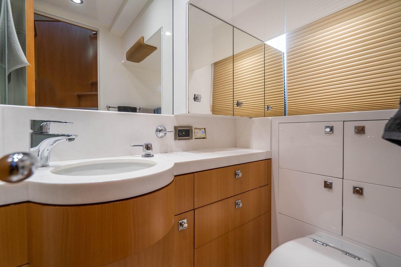 a bathroom with white cabinets aboard SPREZZATURA Yacht for Sale