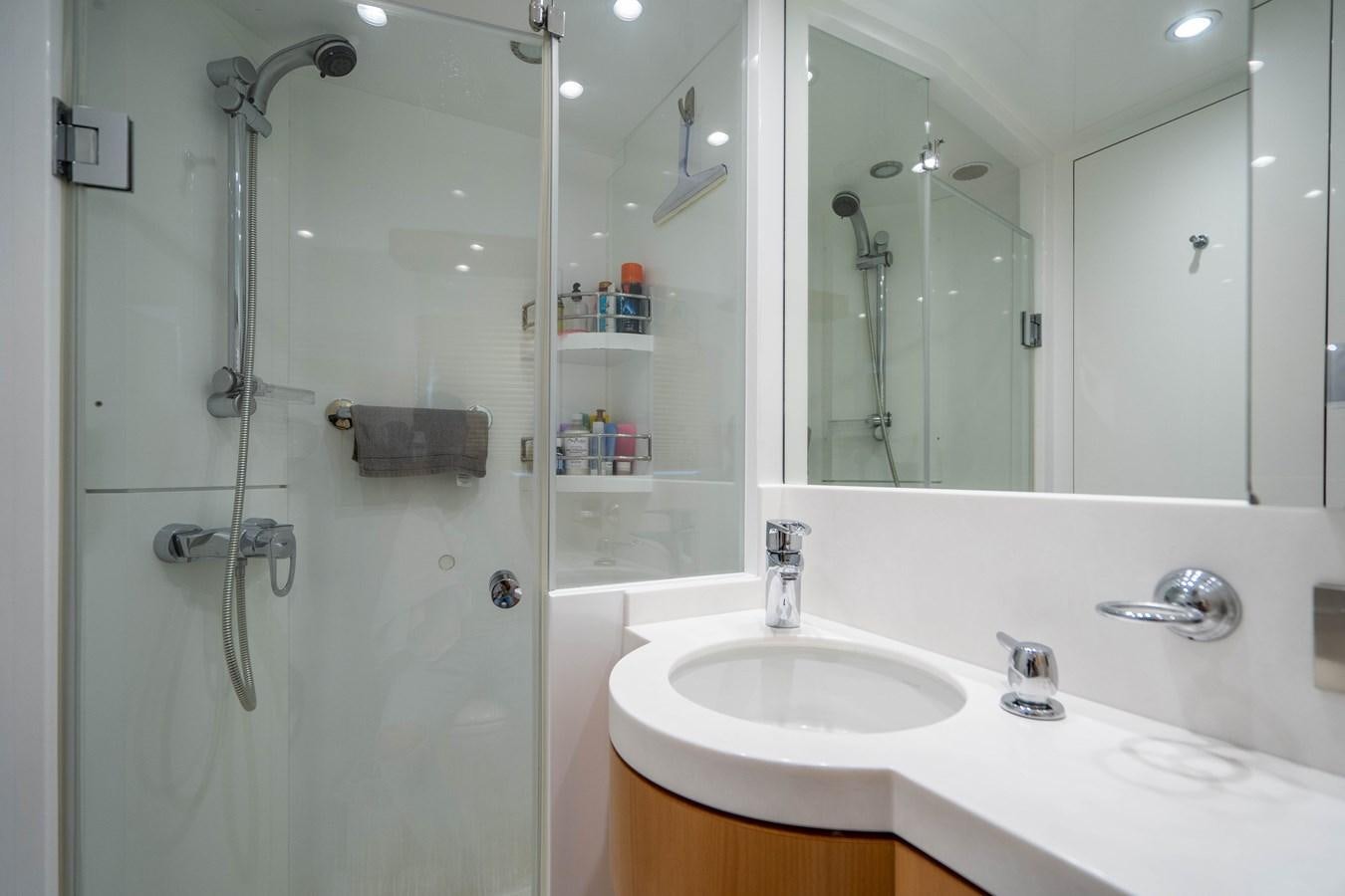 a bathroom with a glass shower aboard SPREZZATURA Yacht for Sale