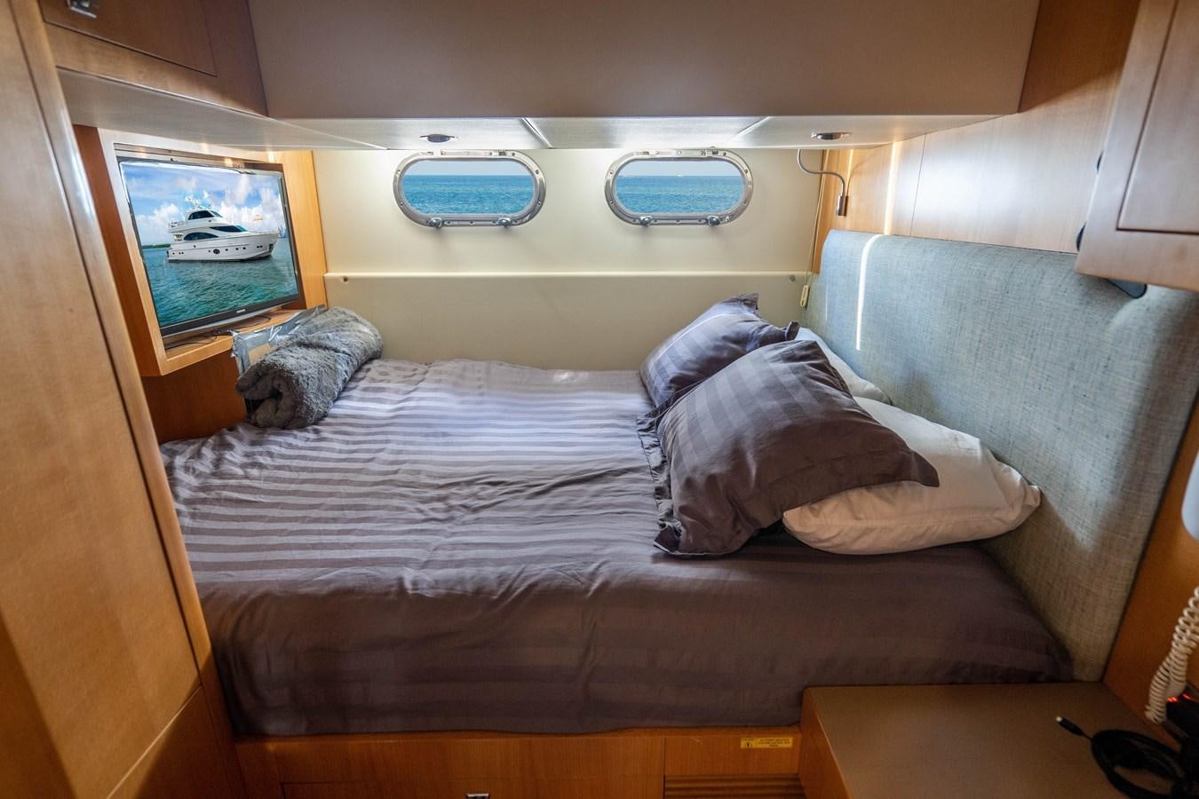 a bed in a room aboard SPREZZATURA Yacht for Sale