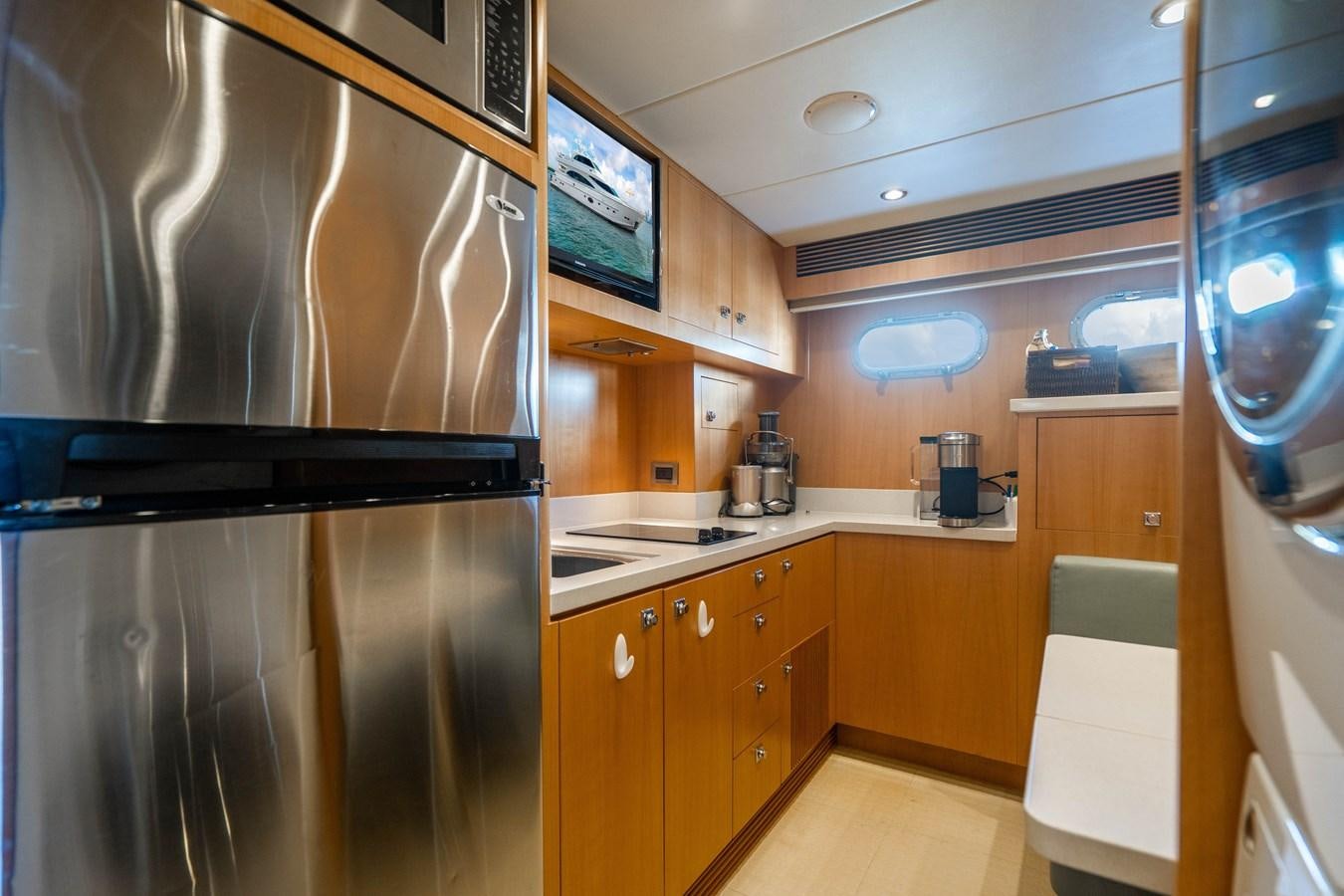 a kitchen with a large refrigerator aboard SPREZZATURA Yacht for Sale