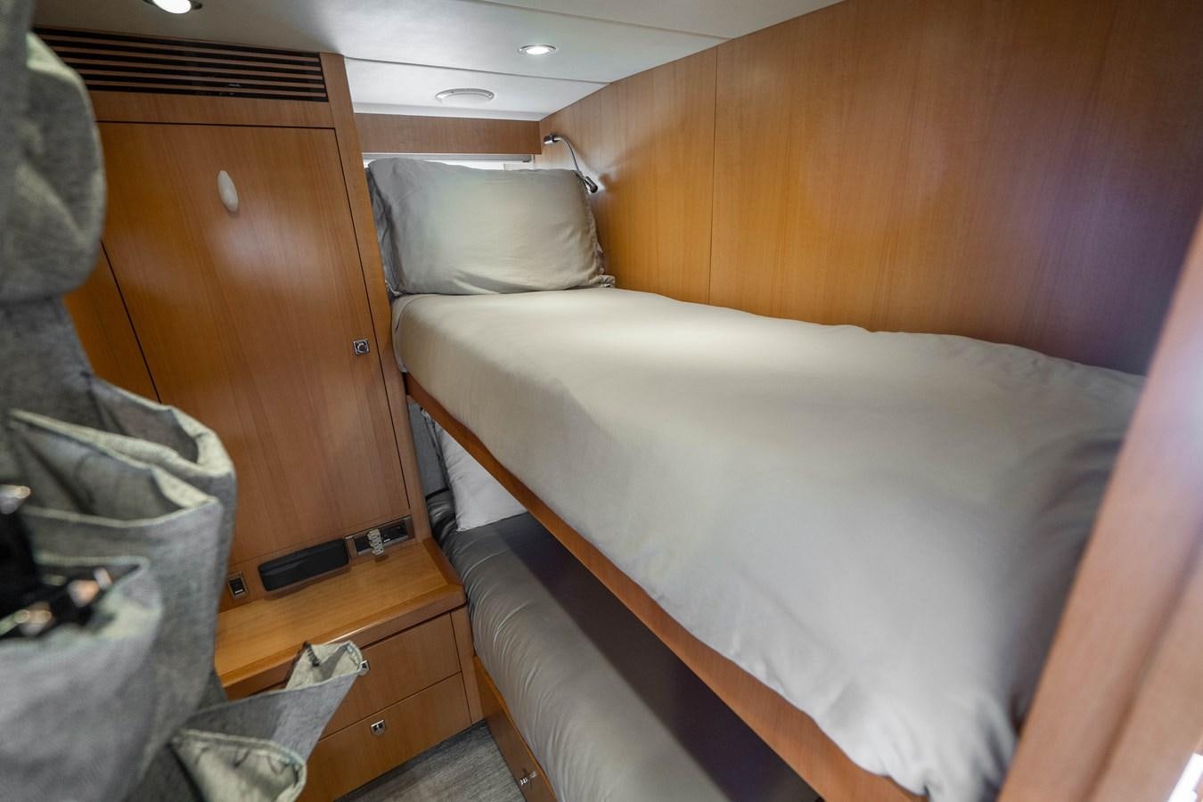 a bed in a room aboard SPREZZATURA Yacht for Sale