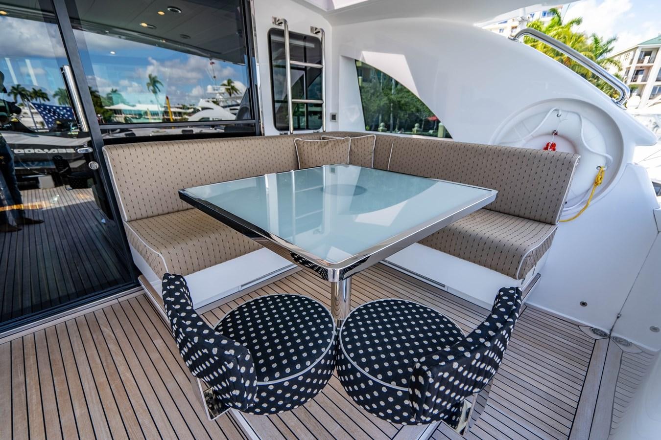 a table and chairs on a deck aboard SPREZZATURA Yacht for Sale