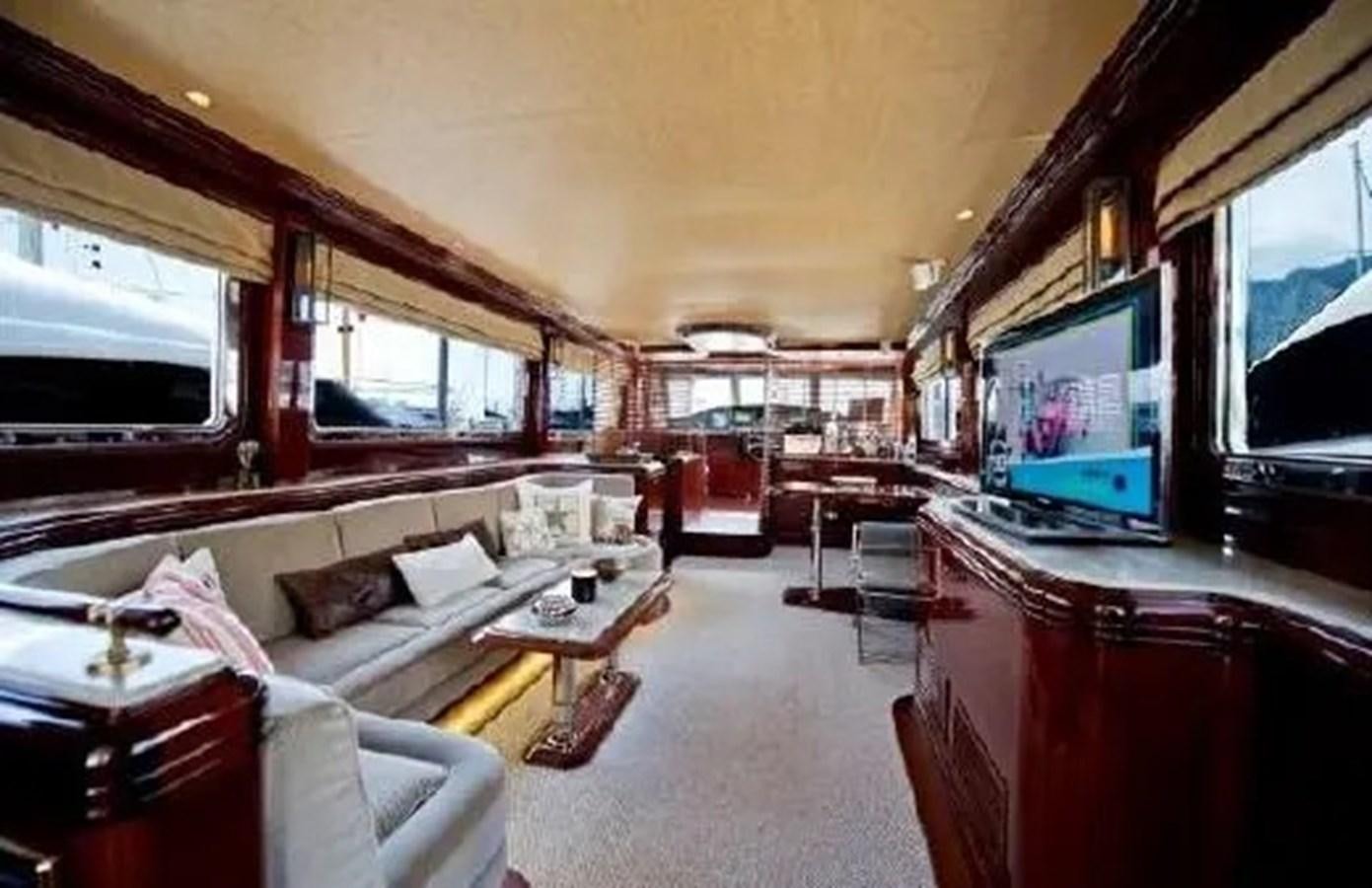 a living room with a couch and tv aboard GRAND AZURE  Yacht for Sale