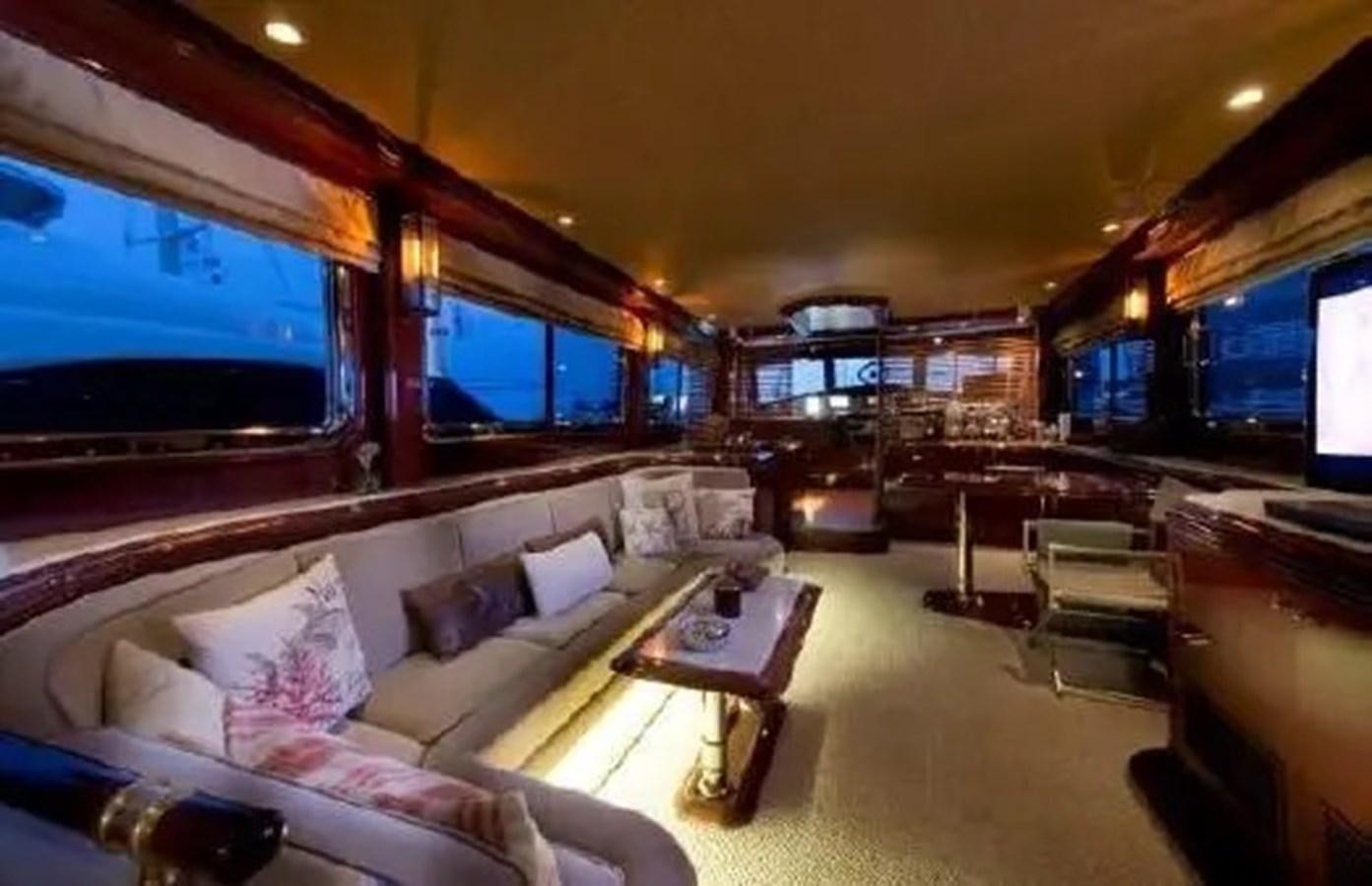 a living room with a large screen aboard GRAND AZURE  Yacht for Sale