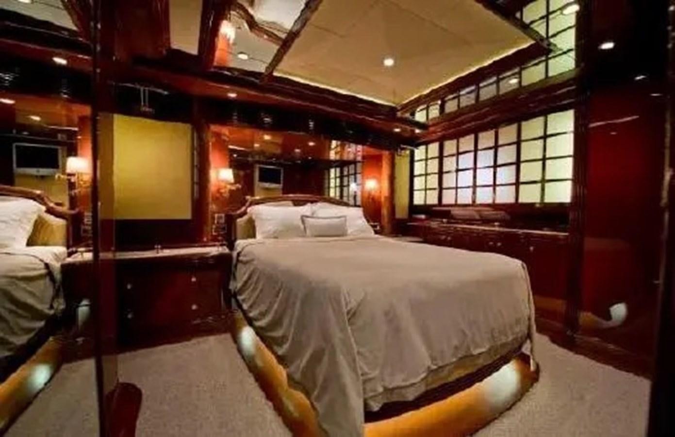 a room with beds and a tv aboard GRAND AZURE  Yacht for Sale