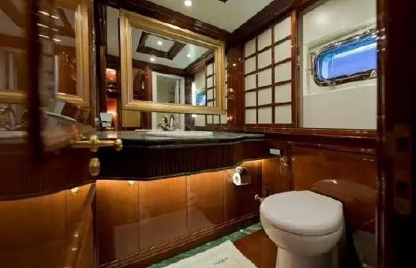 a bathroom with a tub sink and toilet aboard GRAND AZURE  Yacht for Sale