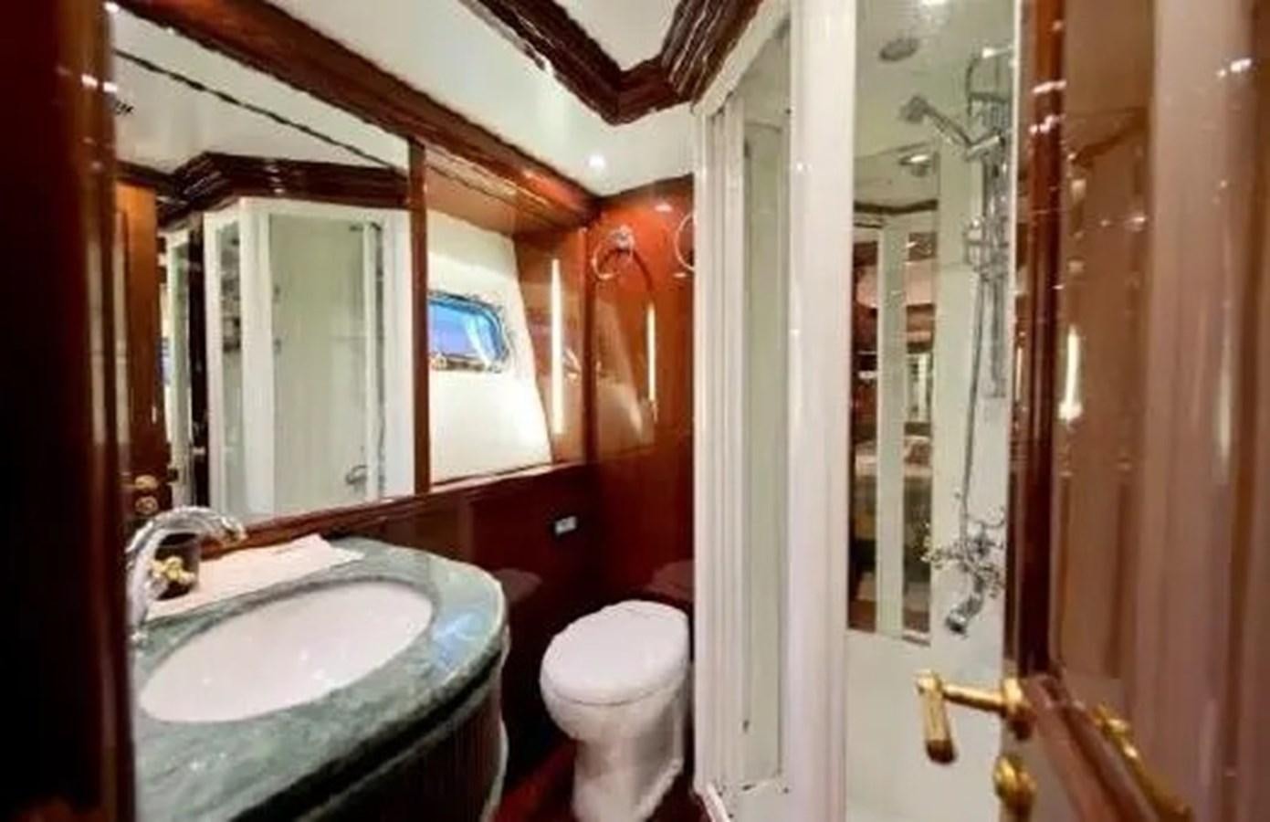 a bathroom with a sink and a toilet aboard GRAND AZURE  Yacht for Sale
