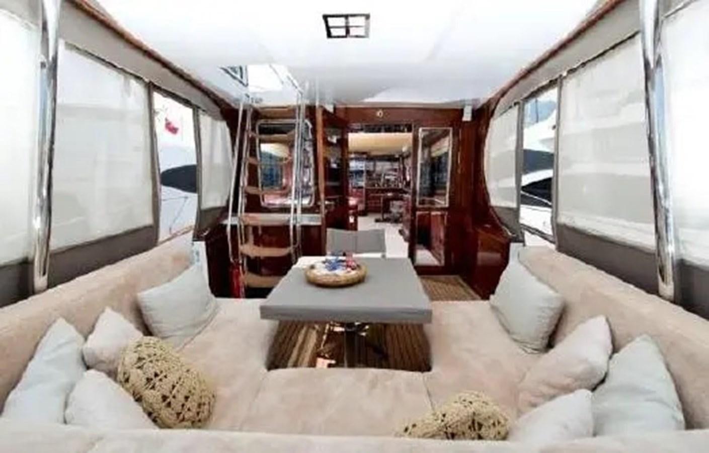 a living room with a large window aboard GRAND AZURE  Yacht for Sale