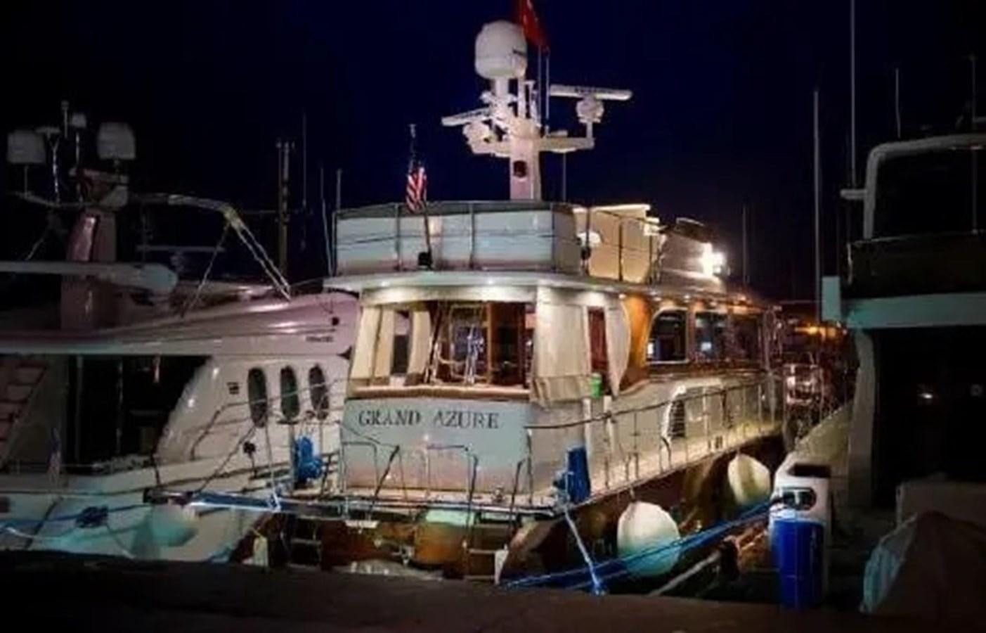 a boat docked at night aboard GRAND AZURE  Yacht for Sale