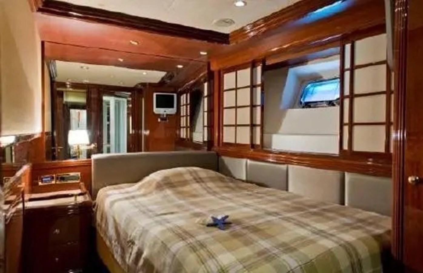a bedroom with a bunk bed aboard GRAND AZURE  Yacht for Sale