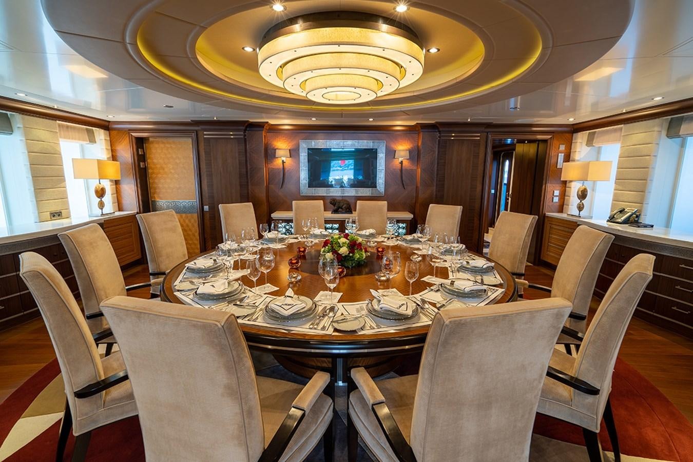 a large room with a table and chairs aboard KAISER Yacht for Sale