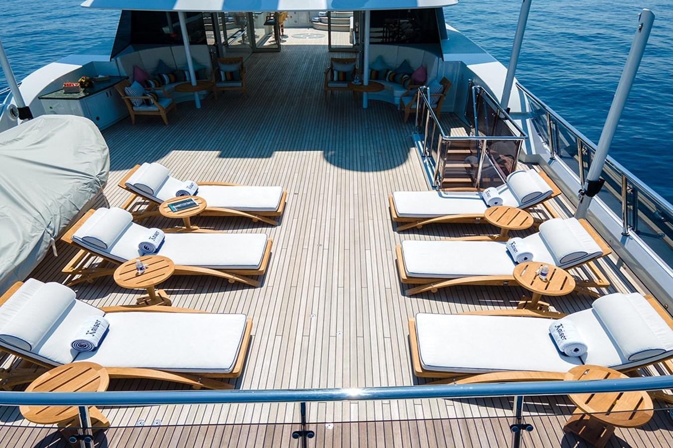 a large room with tables and chairs aboard KAISER Yacht for Sale
