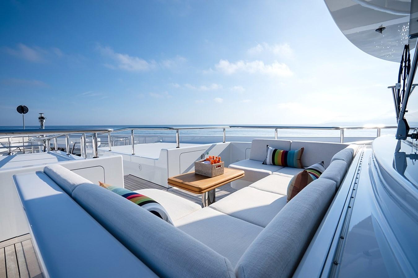 a large white boat with a table on it aboard KAISER Yacht for Sale