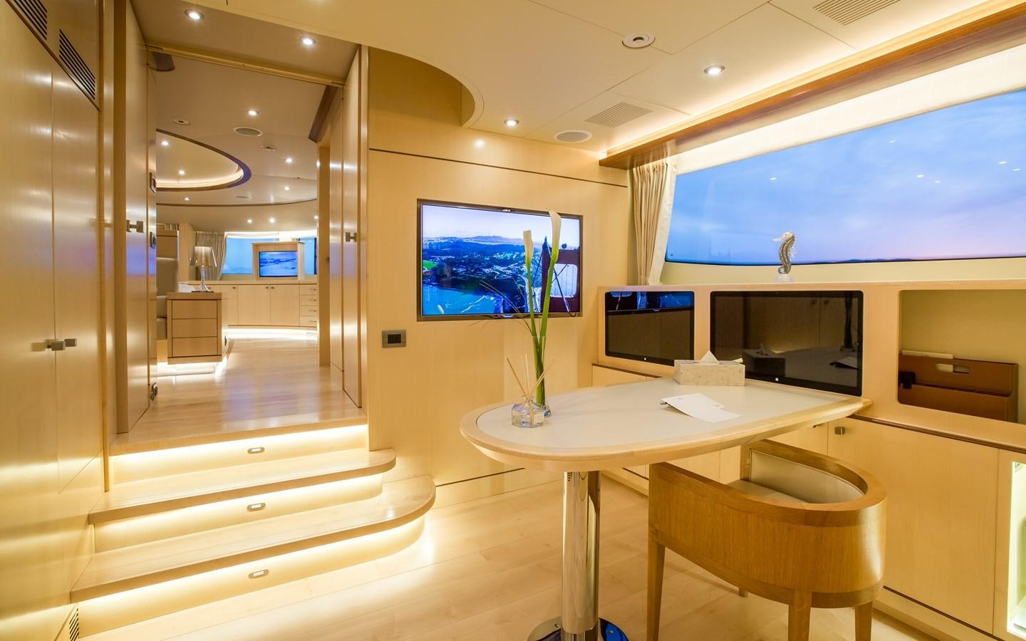 a room with a table and chairs aboard BLUE VISION Yacht for Charter