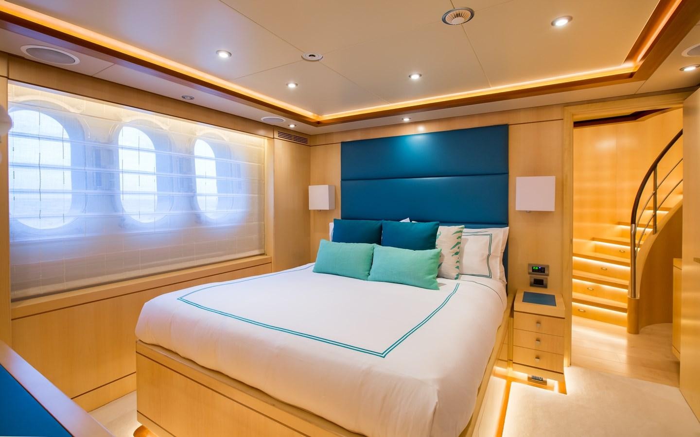a room with a bed and a window aboard BLUE VISION Yacht for Charter
