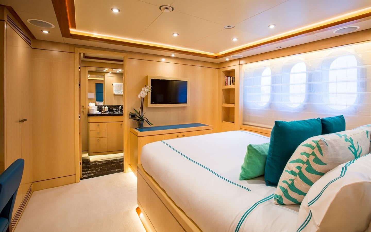 a room with a bed and a tv aboard BLUE VISION Yacht for Charter