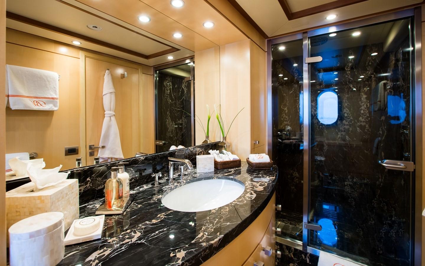 a bathroom with a large marble countertop aboard BLUE VISION Yacht for Charter