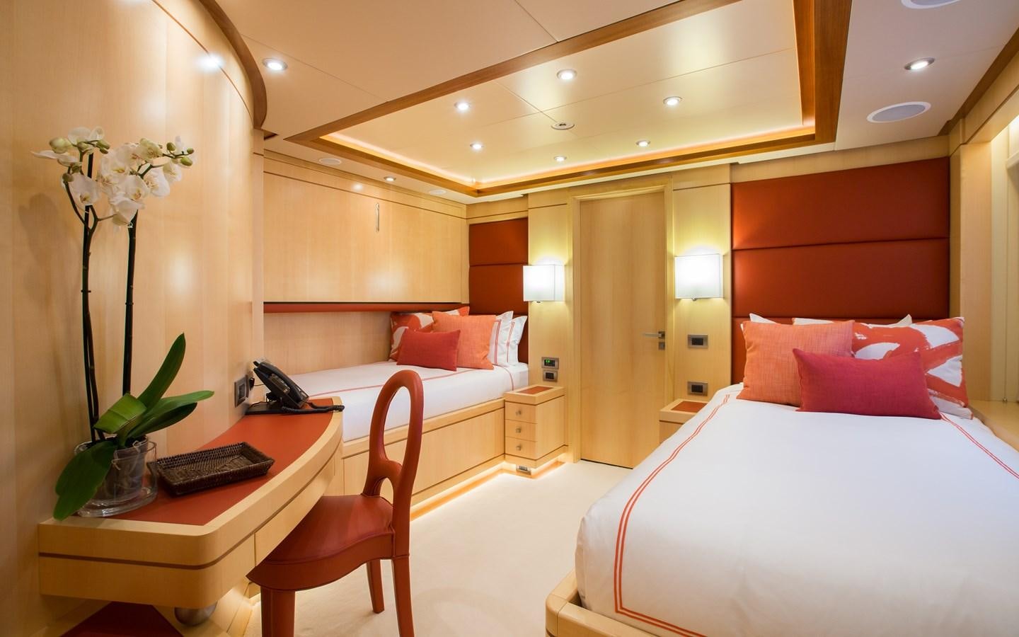 a room with a bed and a desk aboard BLUE VISION Yacht for Charter