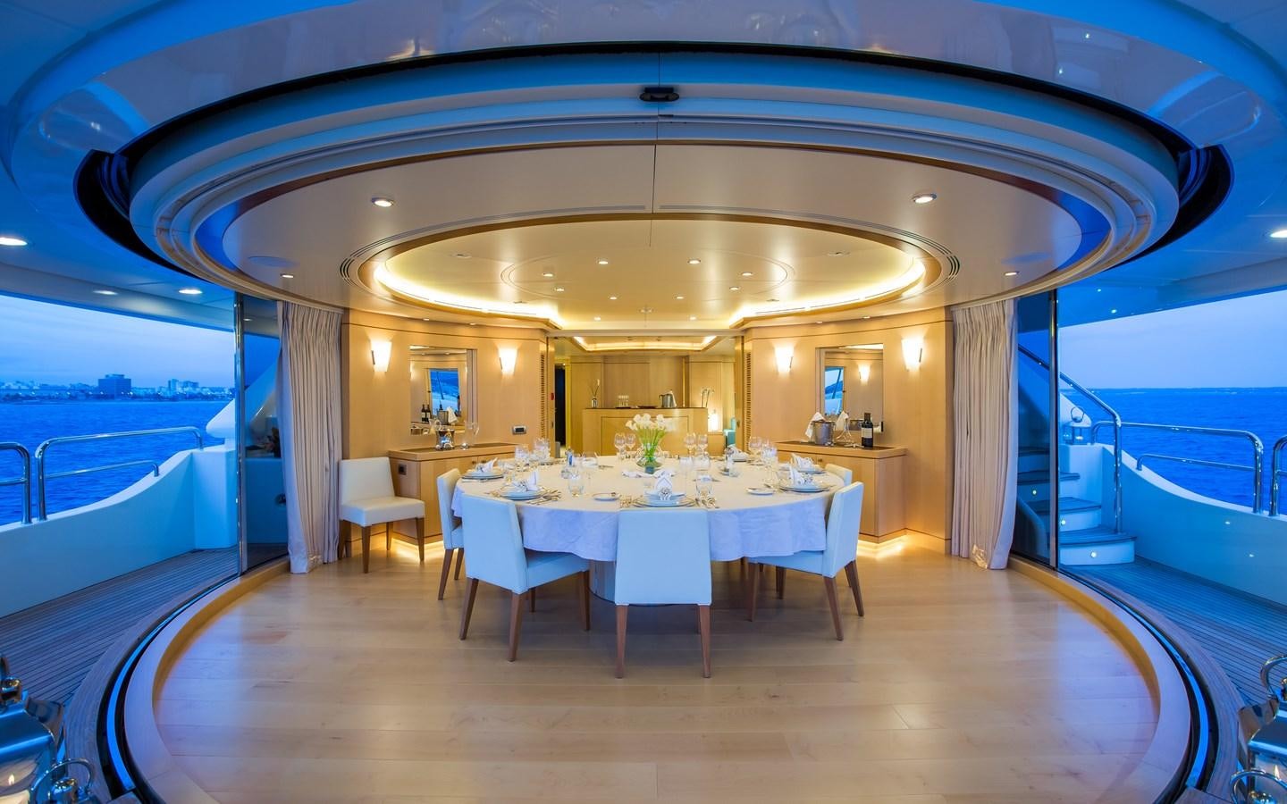 a large room with tables and chairs aboard BLUE VISION Yacht for Charter