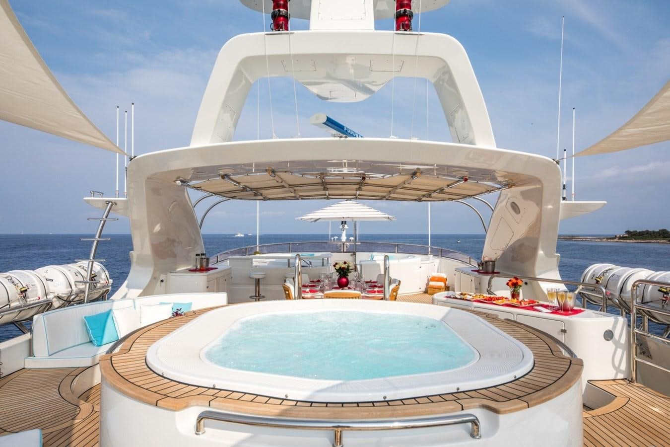 a large white boat with a pool aboard BLUE VISION Yacht for Charter
