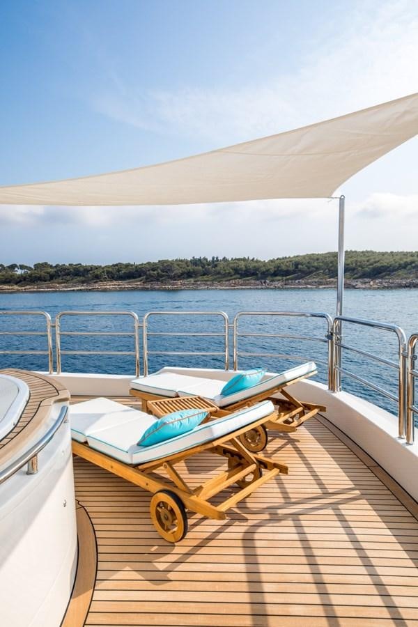 a wooden boat on a deck aboard BLUE VISION Yacht for Charter
