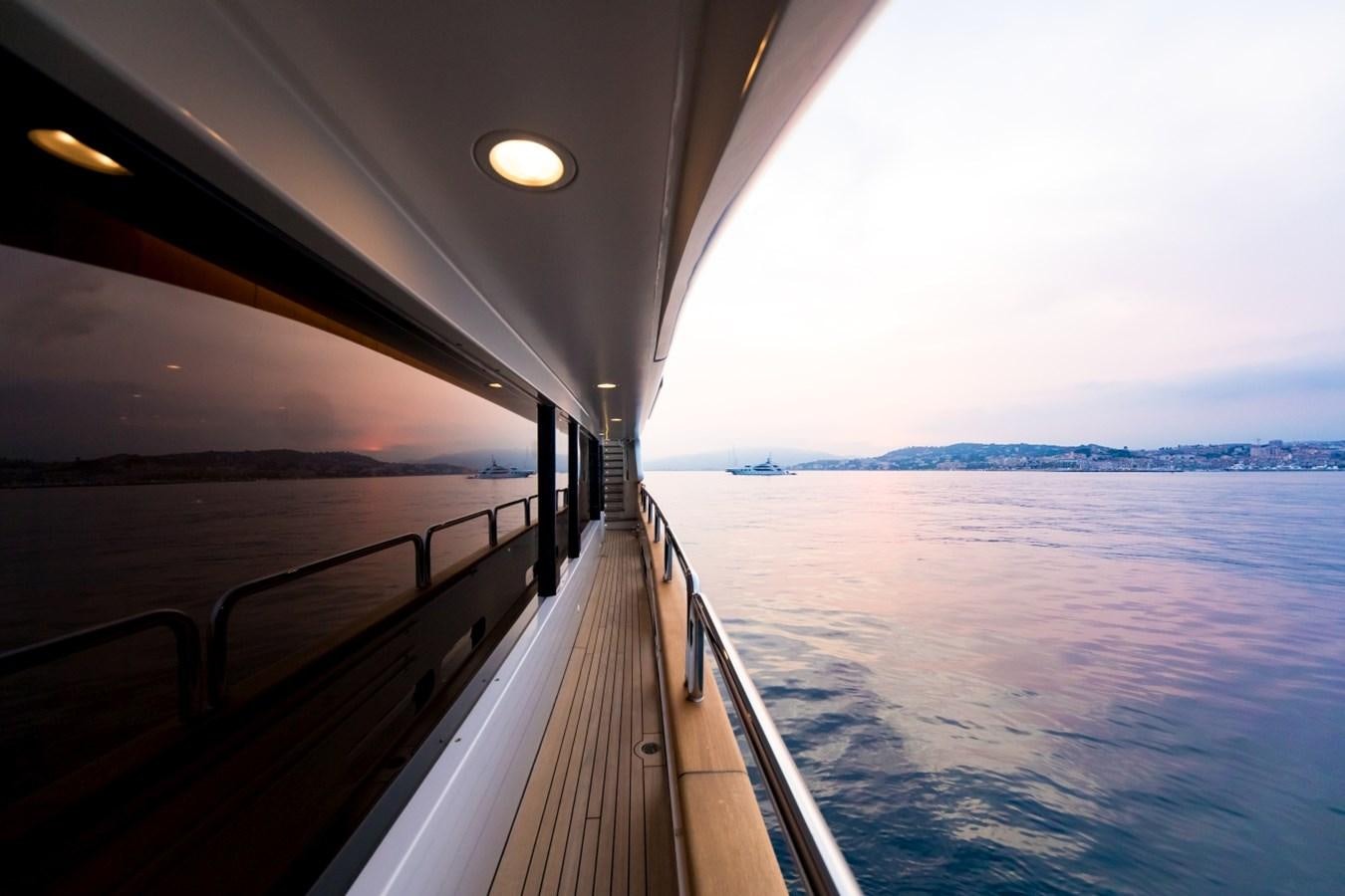 a view of a beach from a balcony aboard BLUE VISION Yacht for Charter