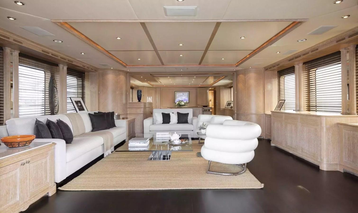 a living room with a large window aboard SOHO Yacht for Charter