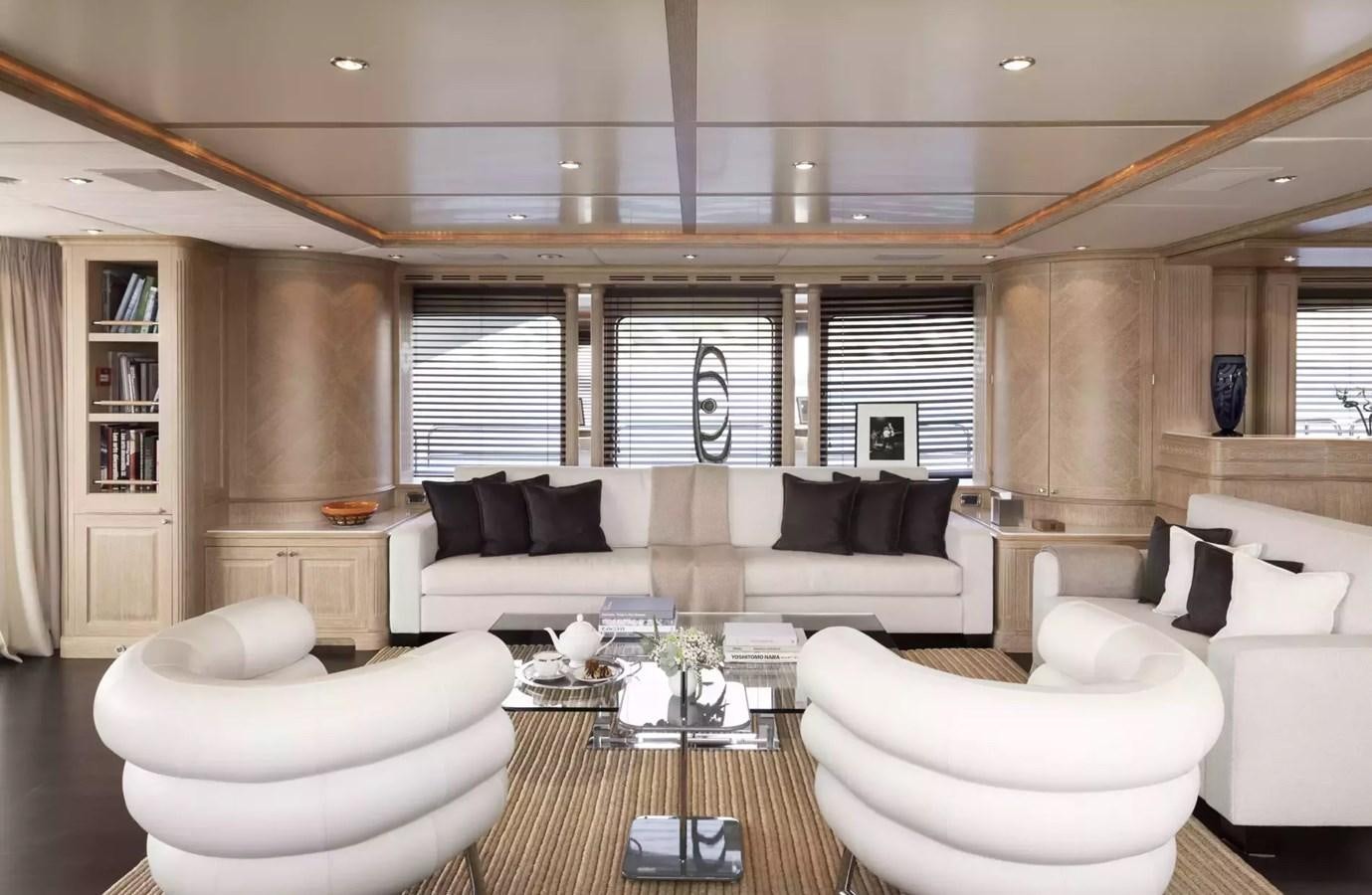 a living room with a couch and a table aboard SOHO Yacht for Charter